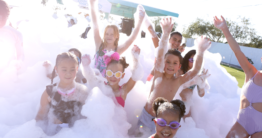 Kids enjoying a party by Texas RocknRoll Foam Zone Foam Party Outdoor Birthday and Childrens Family Entertainment