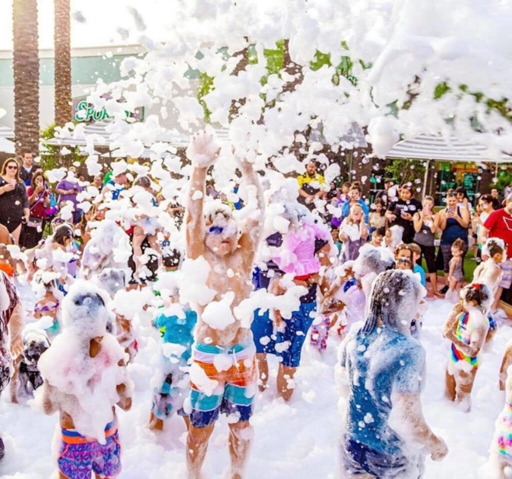 Kids enjoying a party by Texas RocknRoll Foam Zone Foam Party Outdoor Birthday and Childrens Family Entertainment