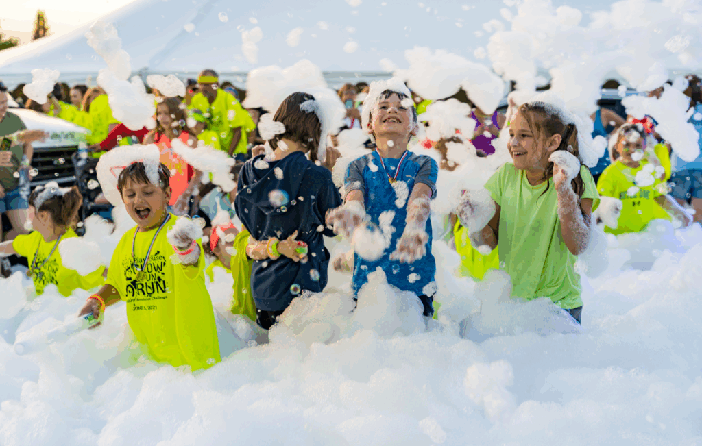 Kids enjoying a party by Texas RocknRoll Foam Zone Foam Party Outdoor Birthday and Childrens Family Entertainment